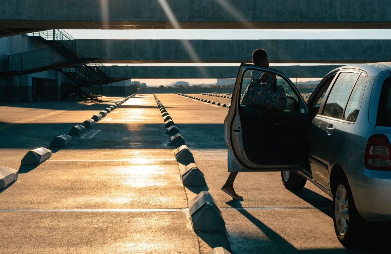 Painted parking bays in raking sunlight